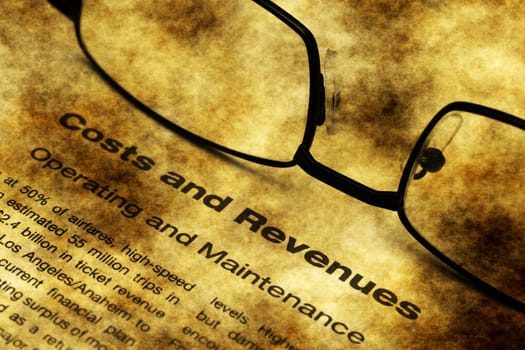 Cost and revenue grunge concept