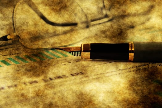 Fountain pen on financial report