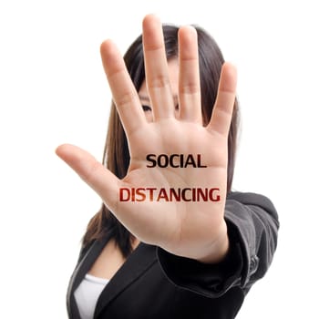 Social distancing to avoid the spread of coronavirus. Woman hand with symbol to keep distance with friend.