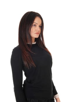 A gorgeous young woman standing in profile in a back.sweater, looking away and sad, isolated for white background.