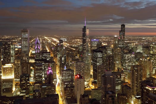 Atmospheric scene of Chicago at night showing Michigan Avenue and downtown