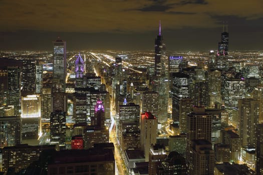 Atmospheric scene of Chicago at night showing Michigan Avenue and downtown