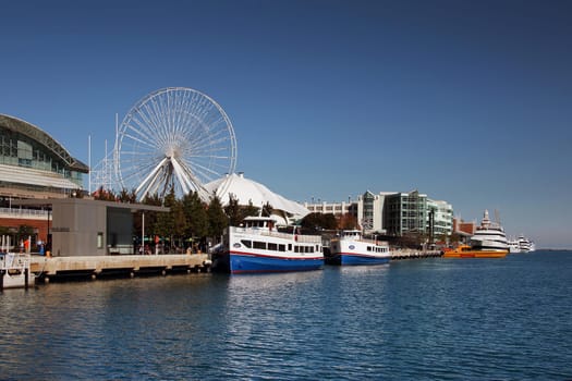 CHICAGO, ILLINOIS/USA-OCTOBER 14 2015: Navy Pier Chicago with boats on October 14 2015, Chicago, Illinois