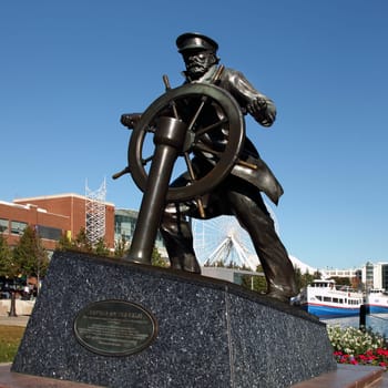 CHICAGO, ILLINOIS/USA-OCTOBER 14 2015: Captain on the Helm sailors memorial statue at Navy Pier Chicago on October 14 2015, Chicago, Illinois