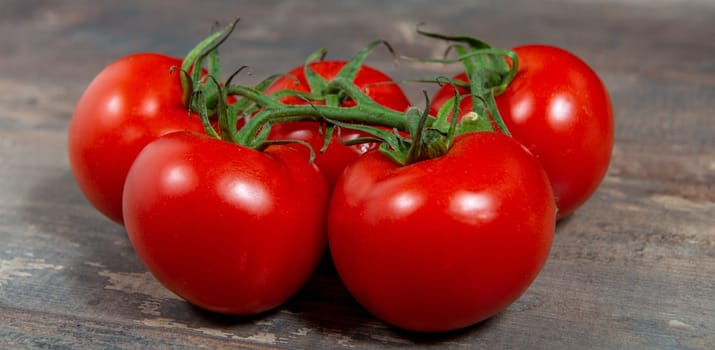 red cherry tomatoes on the rustic background