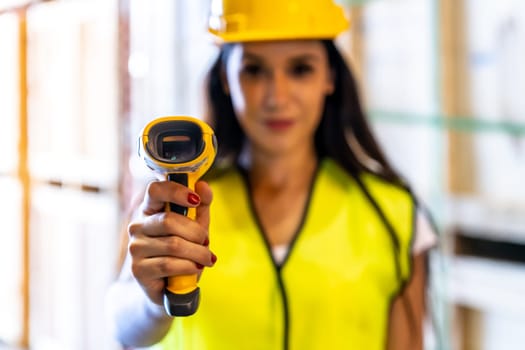 Close up of caucasian white woman warehouse worker hold hand scanner to check inventory stock in distribution warehouse. Traceability FIFO LIFO inventory just in time and warehouse concept photo.