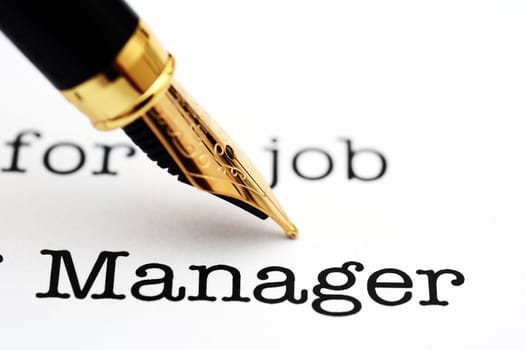 Fountain pen on manager text