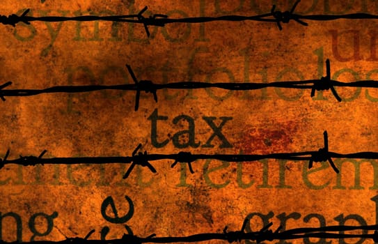 Tax text on grunge background against barbwire