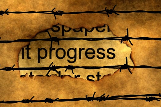 Progress text on paper hole against barbwire