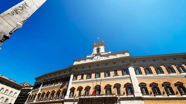 Facade of the Montecitorio Palace in Rome, seat of the Italian Chamber of Deputies in a sunny day.