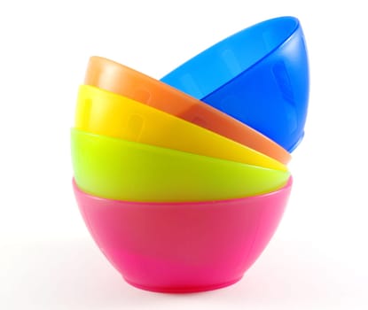 colorful plastic bowls isolated on white background