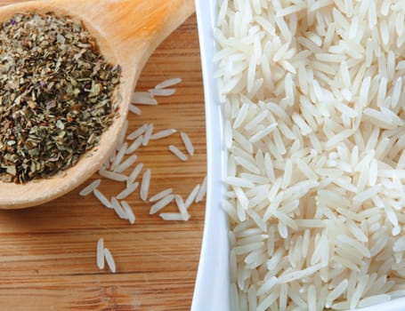 rice and herbs on the wooden board