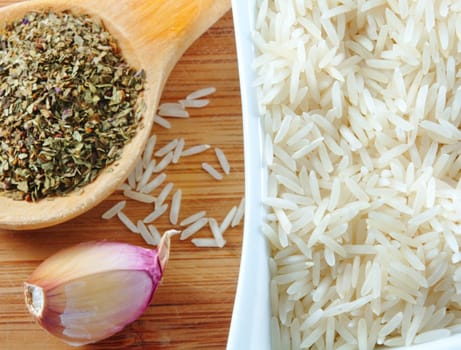 rice and herbs on the wooden board
