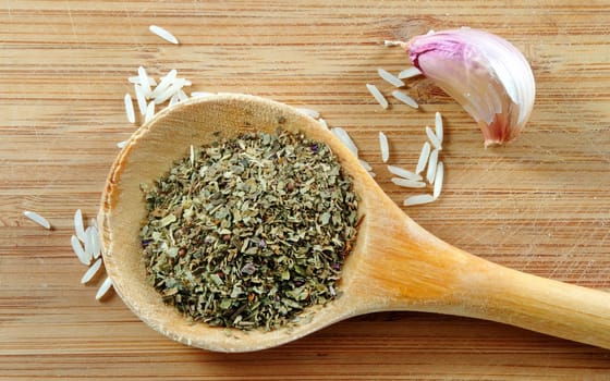 rice and herbs on the wooden board