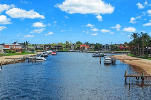 Boats and houses on river.Hdr shot