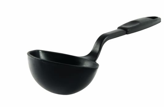 Big black plastic kitchen spoon isolated on white
