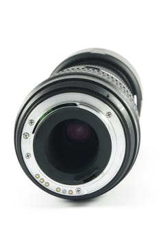 Camera lens  lying on the white surface.Back view