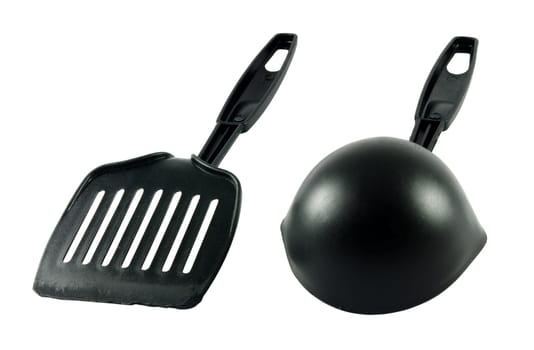 Two kitchen tools over the white surface