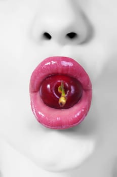 creative picture of woman's lips with cherry