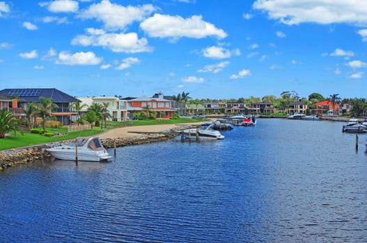 Boats and houses on river.Hdr shot