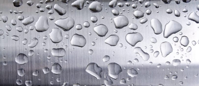closeup of metalic texture with water drops