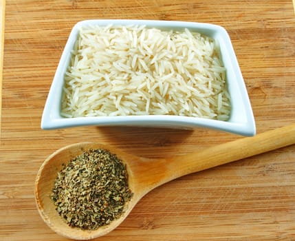 rice and herbs on the wooden board