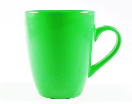 Old green mug isolated on white surface