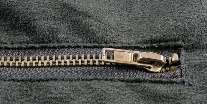 zipper closeup on grey cloth