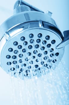 shower head closeup with water