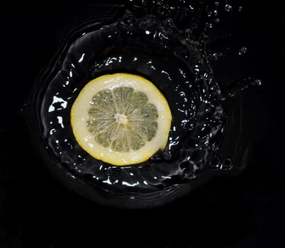 lemon falling into water
