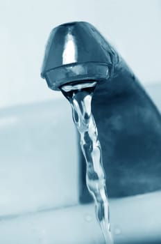 old water tap with running water