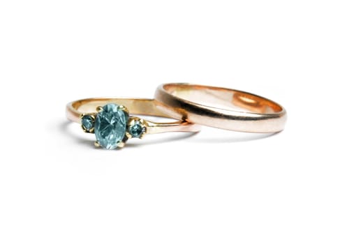 two worn golden rings on white