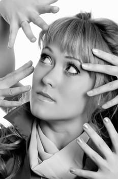 a lot of scary hands over the woman.toned picture