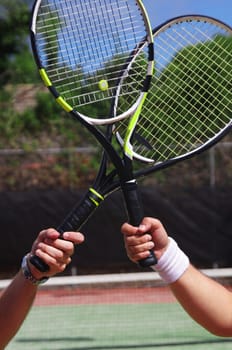 two tennis players with rackets