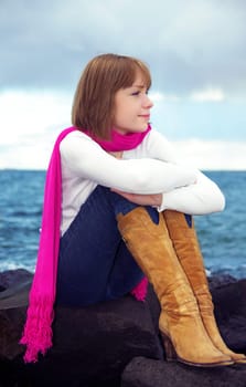 girl looking at sea. evening time