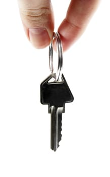 two fingers holding old key..