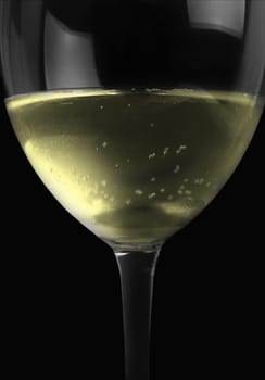 white wine drink in the glass on black