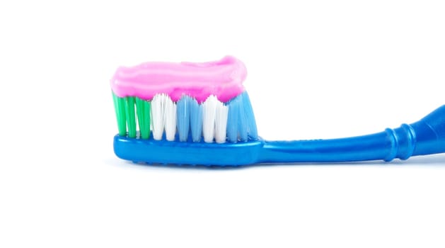 brush and toothpaste isolated on white