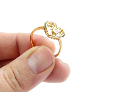 male fingers holding wedding ring with copy space