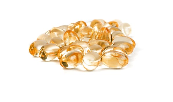 vitamin pills closeup on the white