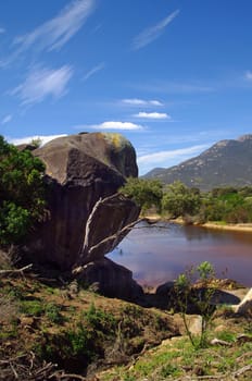 big stone on wild river in Australia