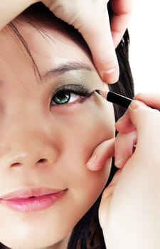 asian girl applying make up