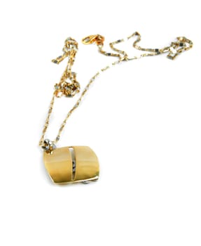 golden necklace with medallion on white