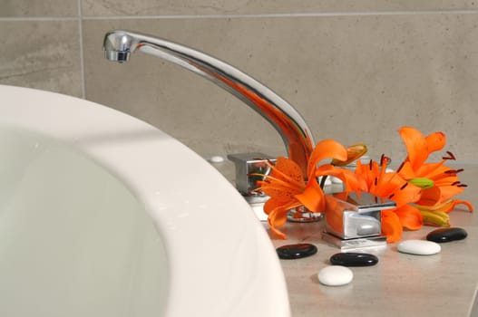 water tap with flowers in spa salon.shallow DOF