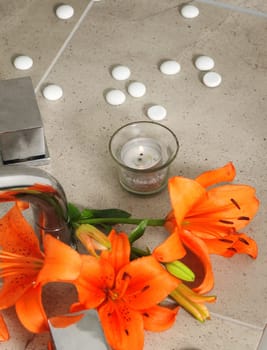 candle and  flowers in spa salon.shallow DOF