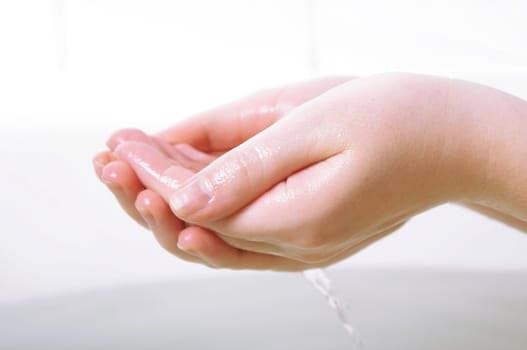 female hands closeup in bath