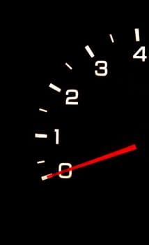 car tachometer closeup in the darkness