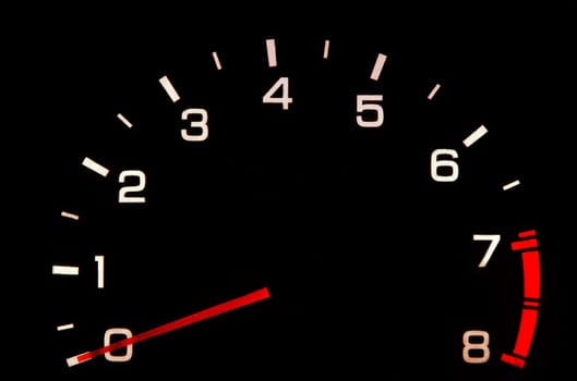 car tachometer closeup in the darkness