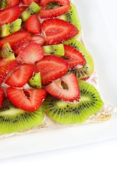 fruit cake closeup with strawberries and kiwi