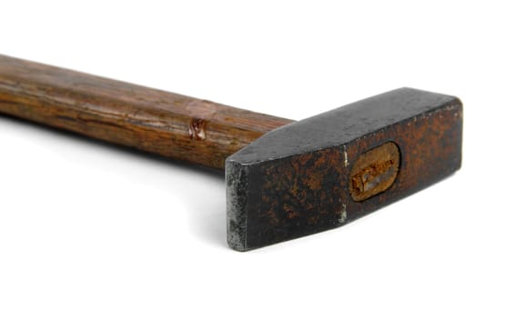 old rusty hammer closeup on white